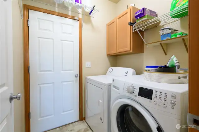 The main floor laundry room leads out to the garage to make unloading groceries convenient, especially on wet days!
