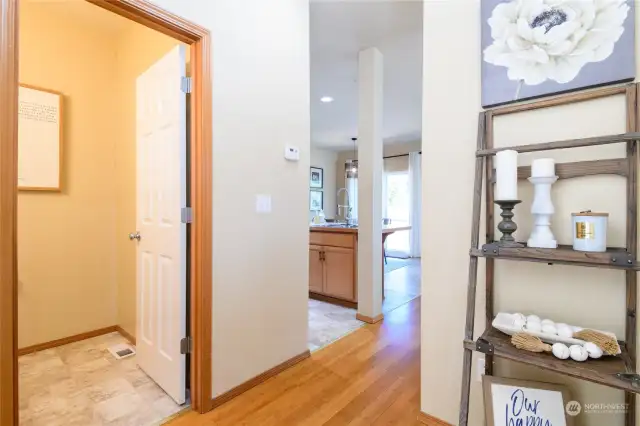 The main floor floor half bath is tucked discreetly away from the main living area. Lovely Bamboo floors grace the Entry and living room.