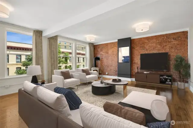 This spectacular urban suite has an extra spacious living room. Photos show virtual staging.