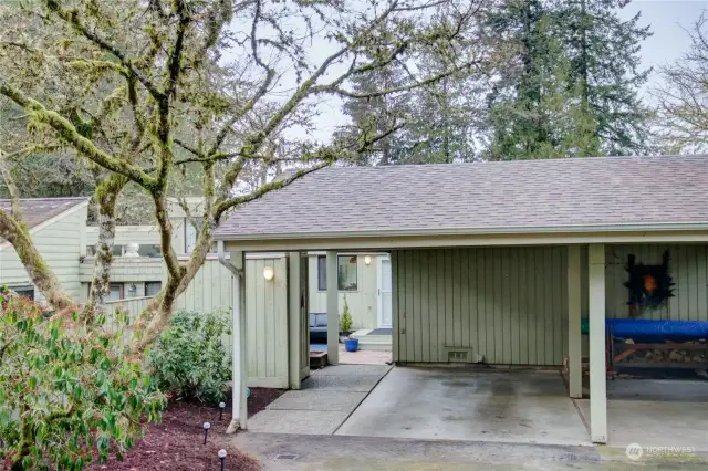 Large carport and exterior storage shed included with this unit.