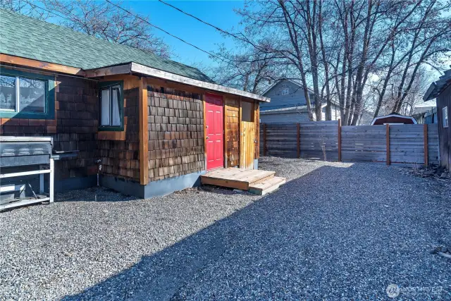 Low maintenance partially fenced back yard