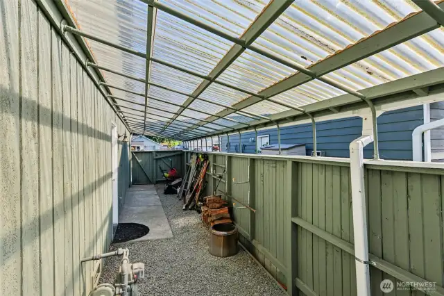 Side of home storage with access to garage.
