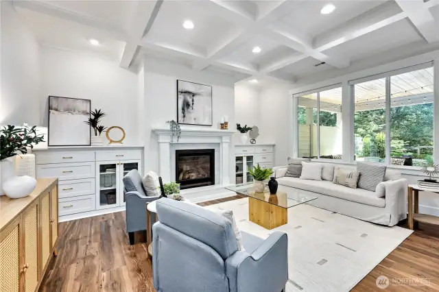 Gorgeous built-ins, a fireplace, a wall of windows and this stylish ceiling await.