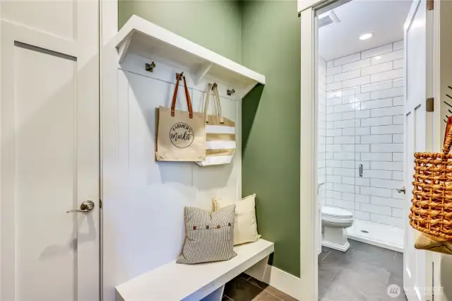 The mud room off of the garage flows into the main floor 3/4 bathroom.