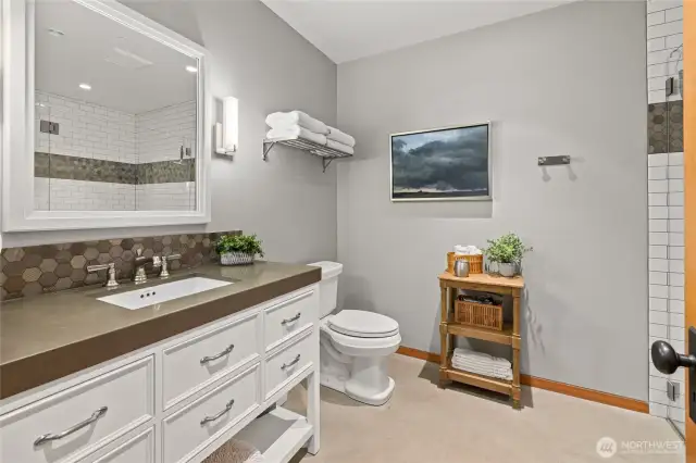 Bathroom one is next to bedroom one and easily accessible for guests.