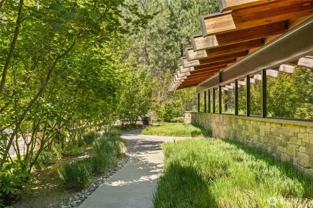 The gallery windows look out to the front of the home and path to the hot tub and garage.