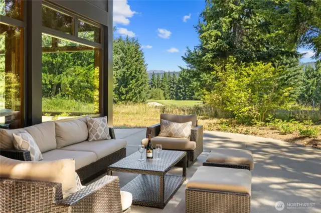 Look out to the 9th green or fairway from this outside living space.