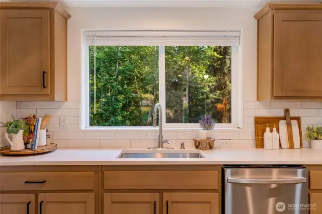 Enjoy serene wooded views right from your sink