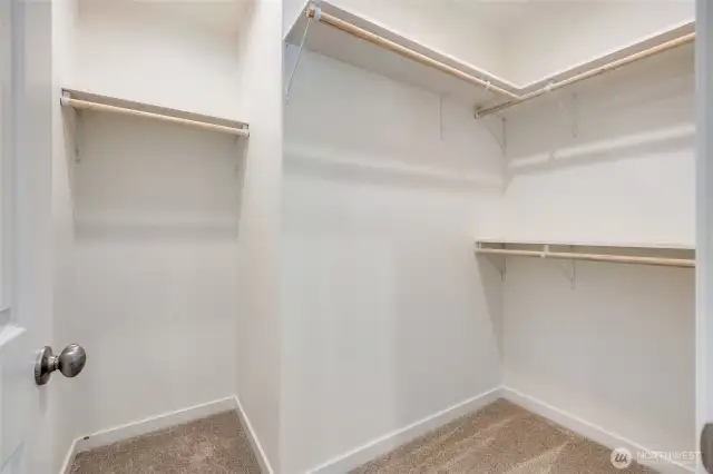 Primary bedroom walk-in closet
