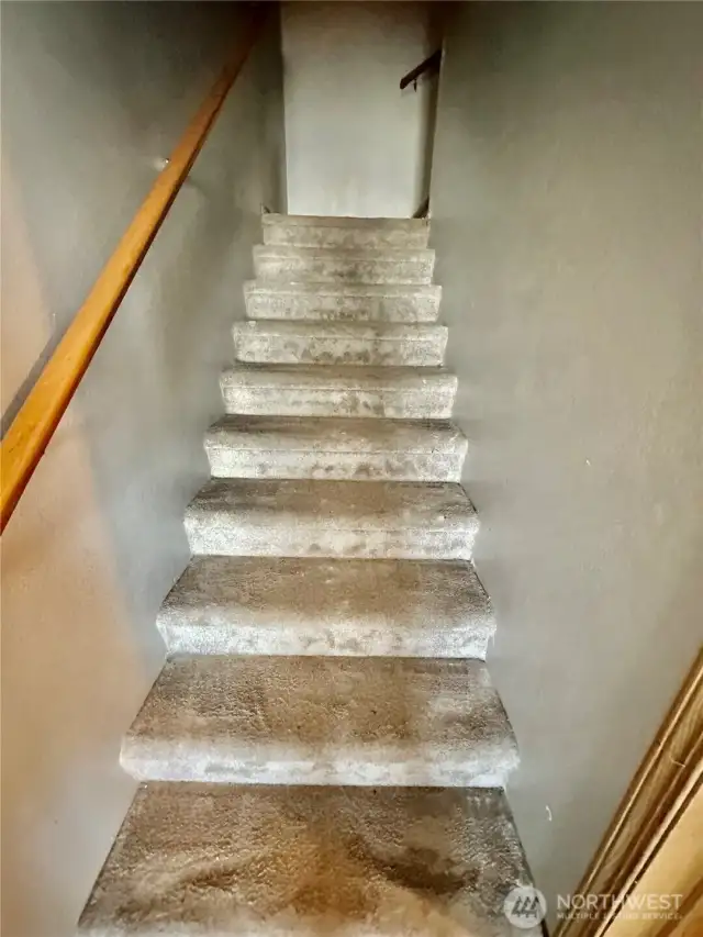 Stairs to the upper floor...primary bedroom, 3 large bedrooms, primary bath and full hall bath.