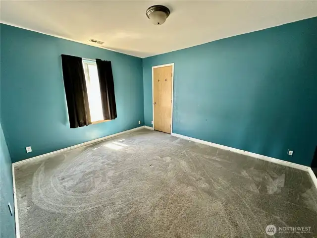 Upper bedroom on the right...good size with walk-in closet.