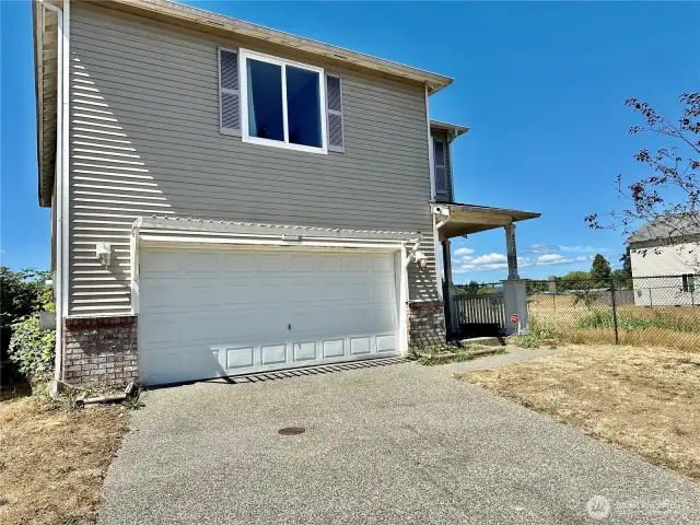 2 car attached garage with electric door opener.