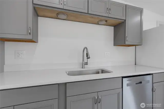 Undermount sink, and under cabinet lighting.
