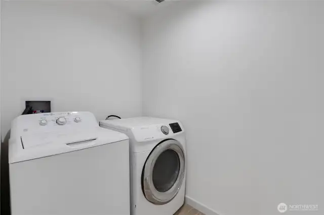 Laundry room conveniently located near the kitchen.