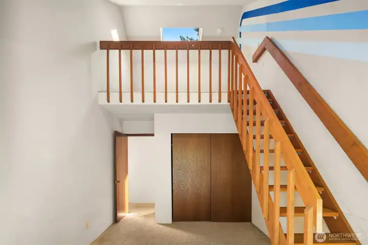 bedroom 2 upstairs w/balcony
