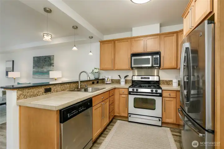 Look at all this counter and cupboard space! The three pendant lights shown have been replaced with a new style after two of the bulbs reached end of use.