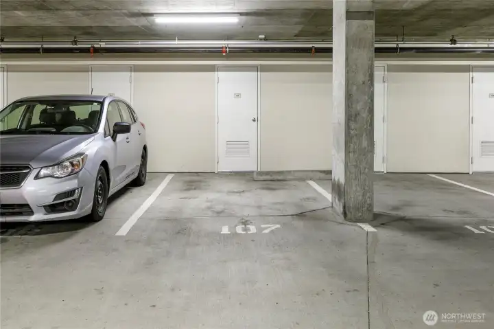Level G2 parking space #107 with private storage locker behind. Owners are allowed to purchase an EV charging station at their space with HOA approval.