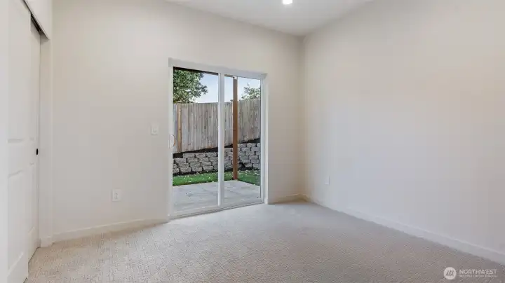 Bedroom with access to fully fenced backyard