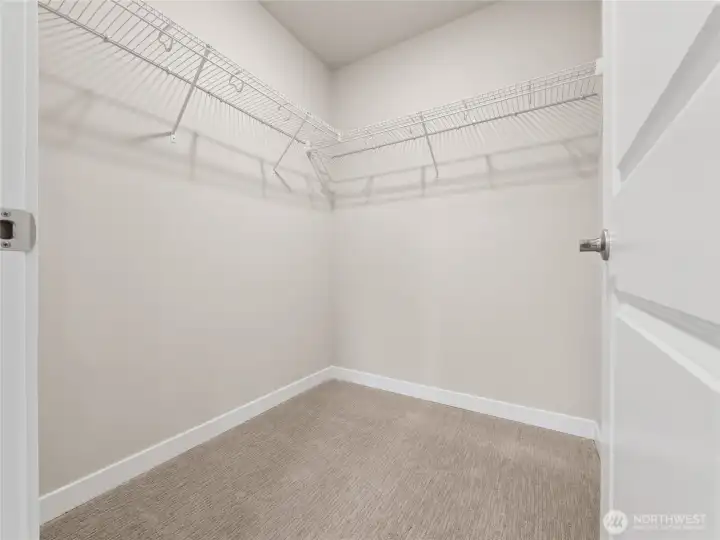 Primary bedroom has walk-in closet off the bedroom, not inside the bathroom.  Actual home is under construction and materials, colors, and finishes will vary. See site agent for details.