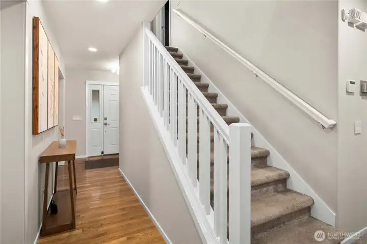 Main floor hallway. Stairs leading to all the bedrooms.