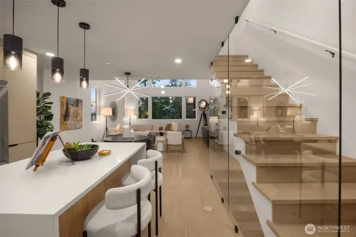 The massive kitchen island features a 3cm waterfall slab with an abundance of eating space