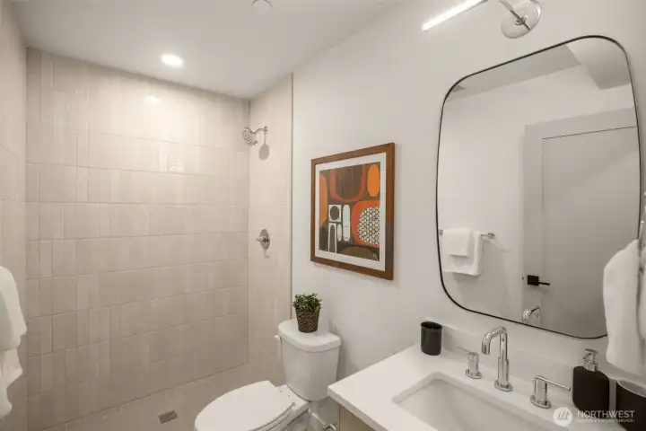 The full bath on the ground level makes an excellent private secondary suite