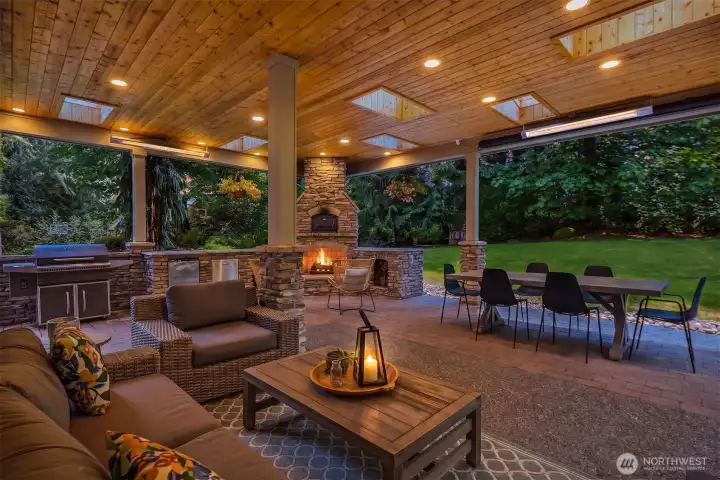 This is where the magic happens - the covered outdoor living space with heaters, pizza oven, gas fireplace, mini-fridge, and pull down movie screen. This is where the magic happens - the covered outdoor living space with heaters, pizza oven, gas fireplace, mini-fridge, and pull down movie screen.