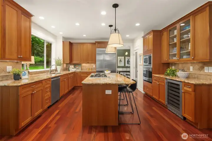 WOW! Soft-close Cherry cabinets, granite countertops, newer high-end stainless steel appliances (including wine/beverage fridge), island with eating bar, and 5 burner gas cooktop with down vent. WOW! Soft-close Cherry cabinets, granite countertops, newer high-end stainless steel appliances (including wine/beverage fridge), island with eating bar, and 5 burner gas cooktop with down vent.