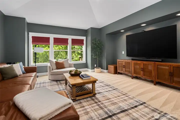Upper level bonus room with French doors, plumbed for wet bar, and darkening shades for movie nights. Upper level bonus room with French doors, plumbed for wet bar, and darkening shades for movie nights.