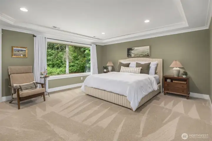 French doors open to this zen-like primary suite with double crown molding, mood lighting, sitting/work-out area, and walk-in closet with built-in organizers. French doors open to this zen-like primary suite with double crown molding, mood lighting, sitting/work-out area, and walk-in closet with built-in organizers.