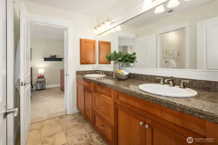 Jack-n-Jill bathroom with dual sinks, granite countertops, lots of cabinet and drawer storage, and a separate door to the bathtub/shower and toilet area (allowing more than one person to get ready at the same time). Jack-n-Jill bathroom with dual sinks, granite countertops, lots of cabinet and drawer storage, and a separate door to the bathtub/shower and toilet area (allowing more than one person to get ready at the same time).
