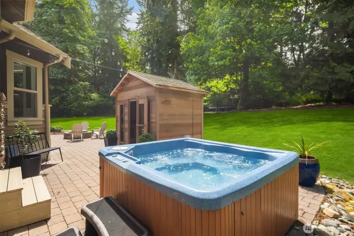 Another view of 6-person sauna, hot tub, fire pit, uncovered patio, and steps to cold-plunge. Come see this truly amazing property and make it your next happy place. Another view of 6-person sauna, hot tub, fire pit, uncovered patio, and steps to cold-plunge. Come see this truly amazing property and make it your next happy place.