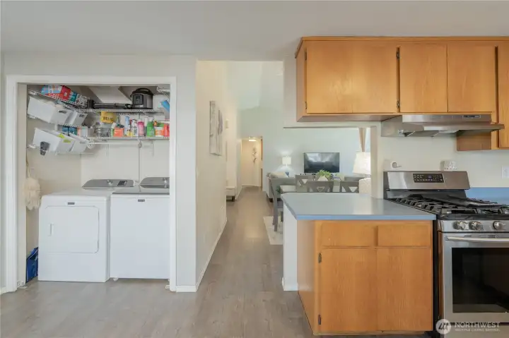 Laundry area off eating space in kitchen.