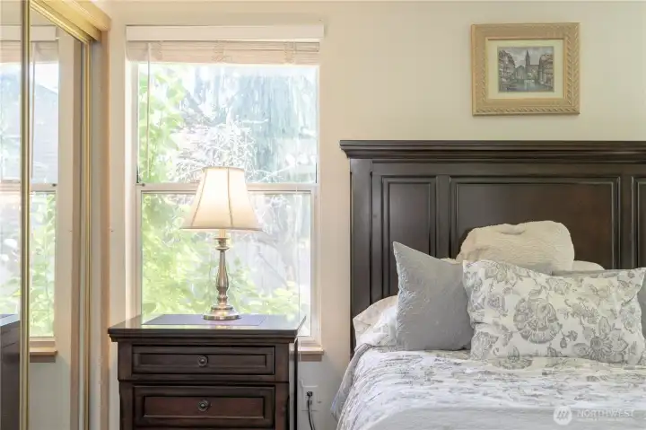 Natural light and double closets in primary bedroom