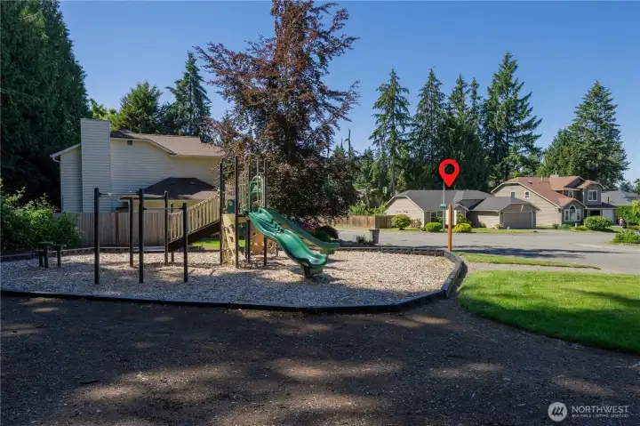 Community playground across street from this rambler.