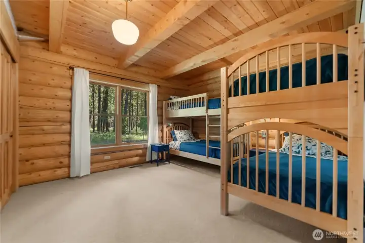 Comfortable bunk room designed for memorable cabin weekends.