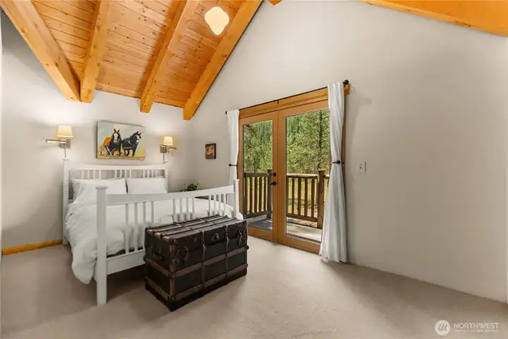 Vaulted ceilings, natural light, a private balcony creates a relaxing mountain retreat.