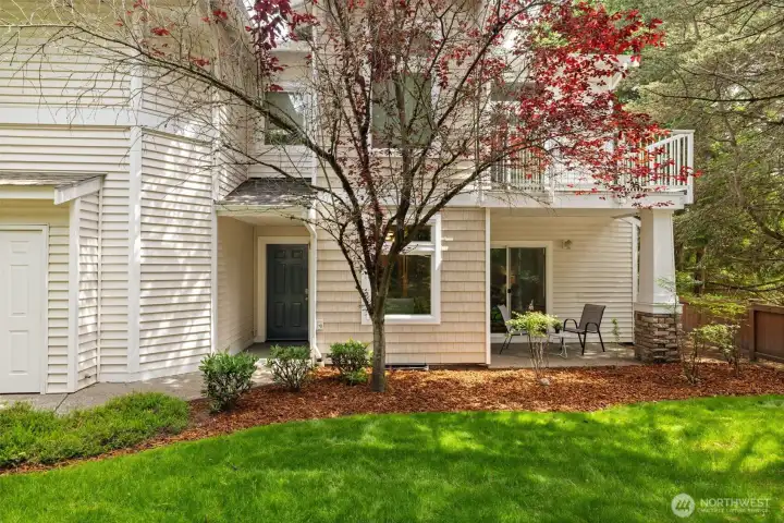 The view of the unit from the grassy area in front of the patio.