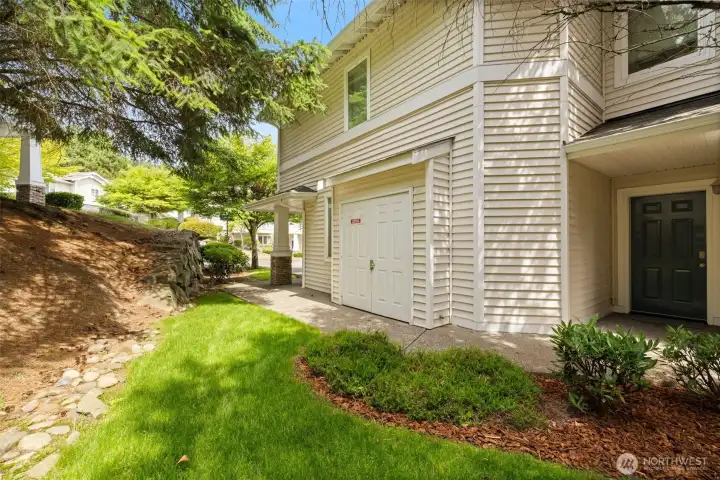 The path walking towards the parking space and exterior of garage.