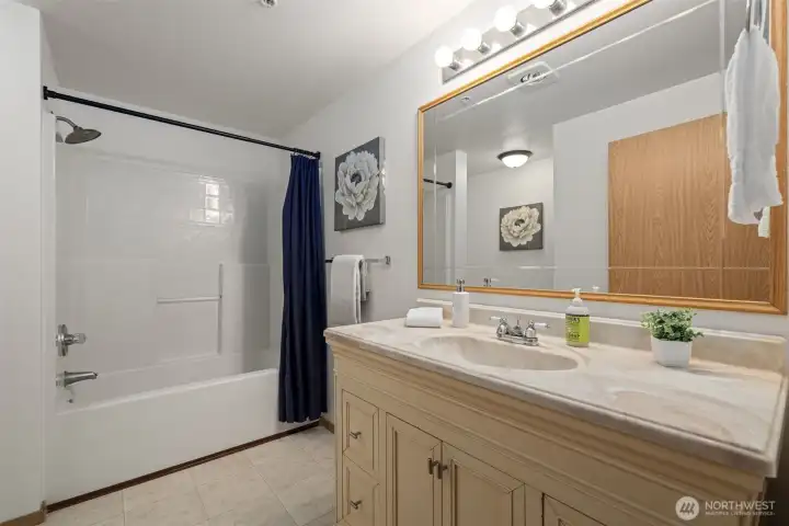 Main bathroom across from the additional bedroom.