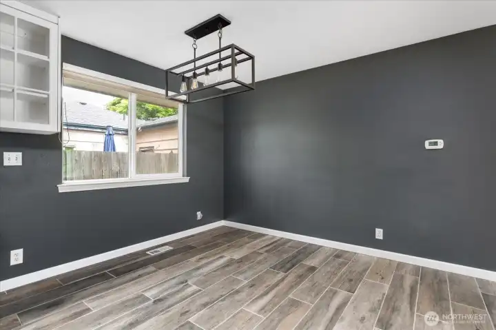 The home features a defined dining area, creating a seamless space for both casual dining and gatherings.