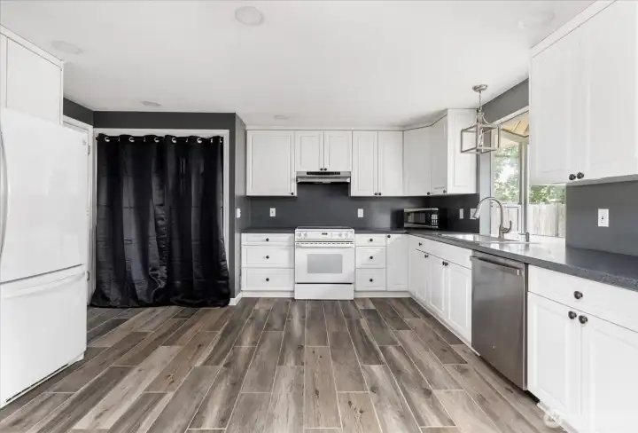 Washer and dryer conveniently located near the kitchen