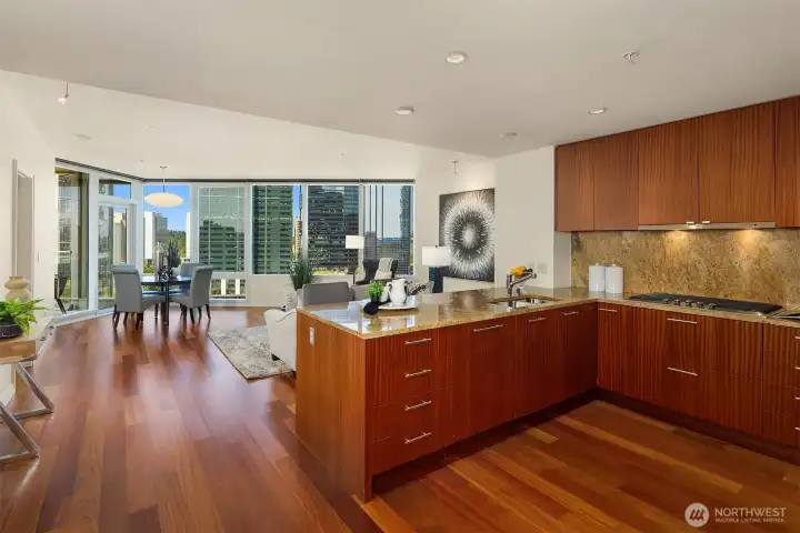 The open-concept design connects the kitchen, living, and dining rooms with ease. The open-concept design connects the kitchen, living, and dining rooms with ease.