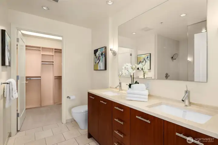 The spa-like bath features dual vanities and leads to a spacious, professionally outfitted walk-in closet. The spa-like bath features dual vanities and leads to a spacious, professionally outfitted walk-in closet.