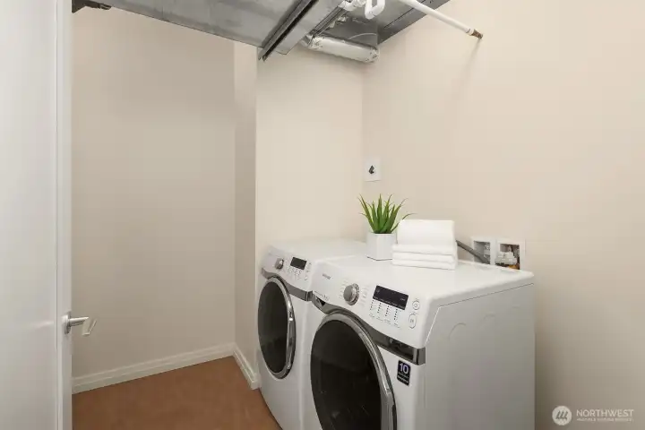 An oversized laundry room with side-by-side machines and room to spare. An oversized laundry room with side-by-side machines and room to spare.