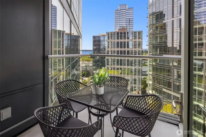 The private covered balcony has a gas stub for grilling and overlooks downtown Bellevue with peek-a-boo views of Lake Washington and the Cascade Mountains. The private covered balcony has a gas stub for grilling and overlooks downtown Bellevue with peek-a-boo views of Lake Washington and the Cascade Mountains.
