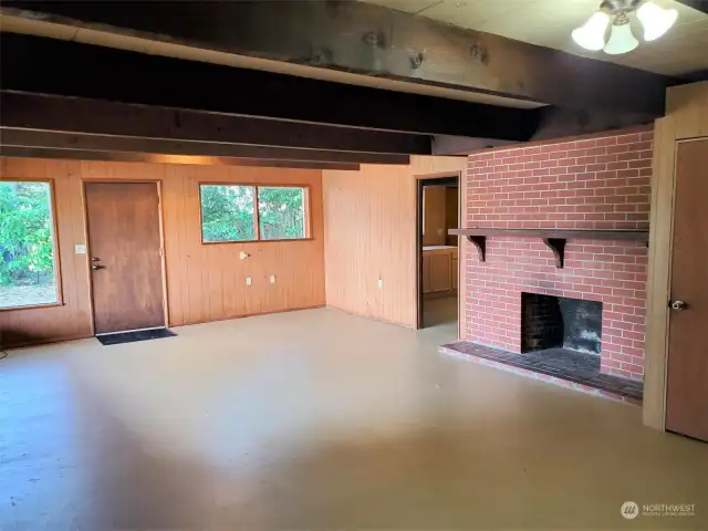 Door just beyond the fireplace in rec room leads to the large bonus room/shop.