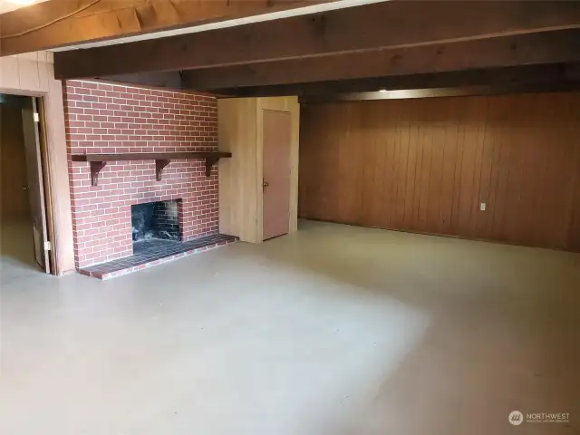 Huge rec room downstairs with brick fireplace.   Potential to plumb a bathroom in 2nd downstairs bonus room to make a great rental possibility.