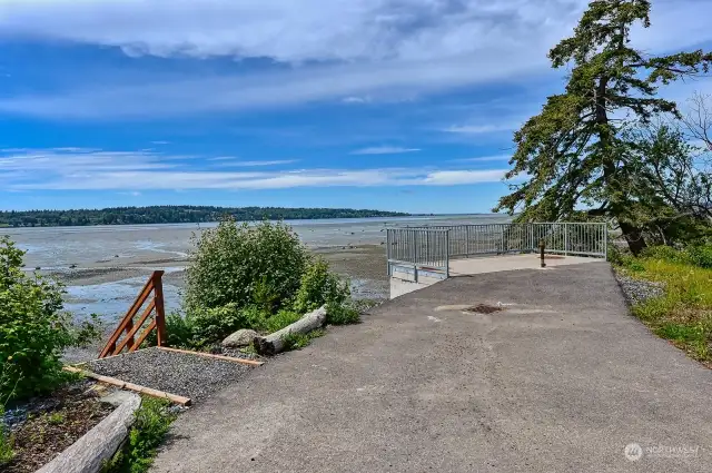 The bay lookout provides a great place to appreciate the beautiful surroundings. And stairs to the beach are on the left.