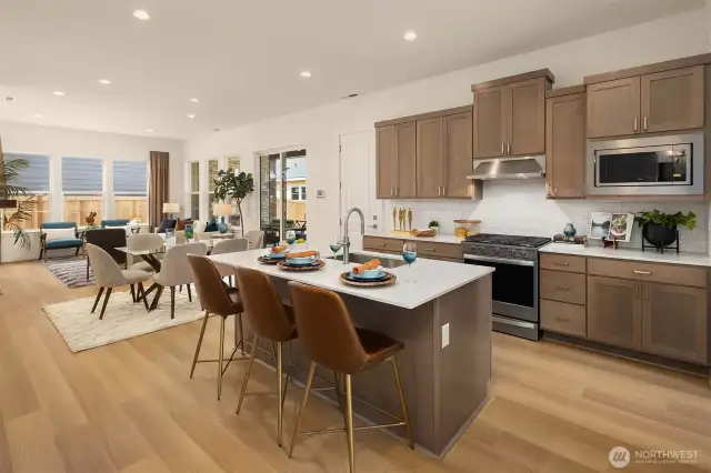 Ktichen, dining and great room. *photo taken from another similar staged home*